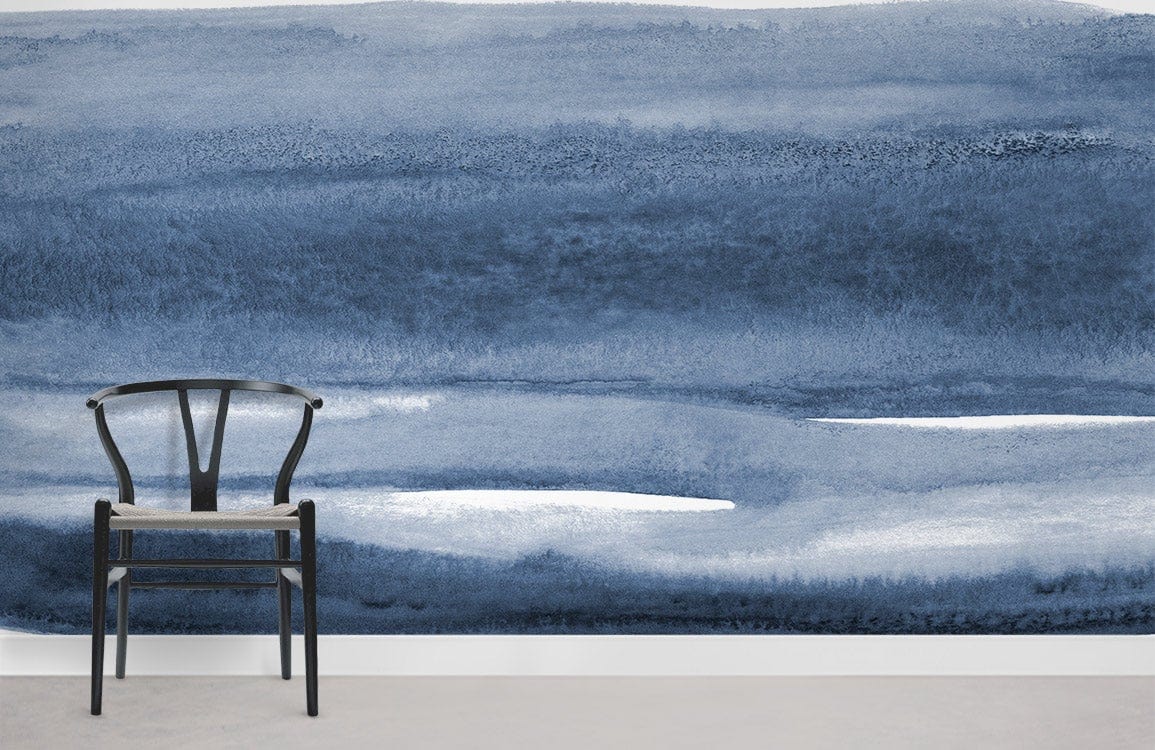 Blue Watercolour Horizon Mural Wallpaper with black chair in minimalist room, featuring grey flooring.