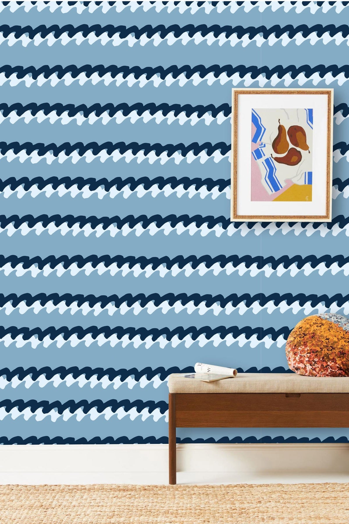 Blue Wave Patterned Striped Wallpaper with framed artwork above wooden bench, modern coastal home decor.