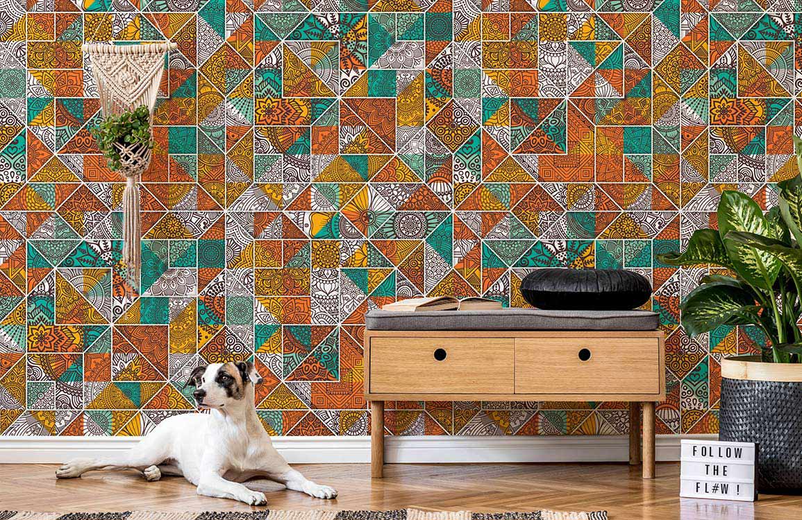 Rustic geometric mosaic wallpaper with vibrant tiles, wooden console table, stylish rug, and leafy plant.