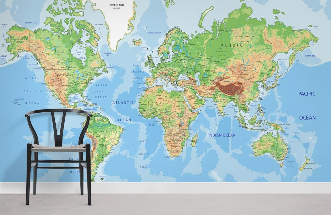 Colourful World Map Mural Wallpaper with chair, light grey flooring, educational geographic design for homes.