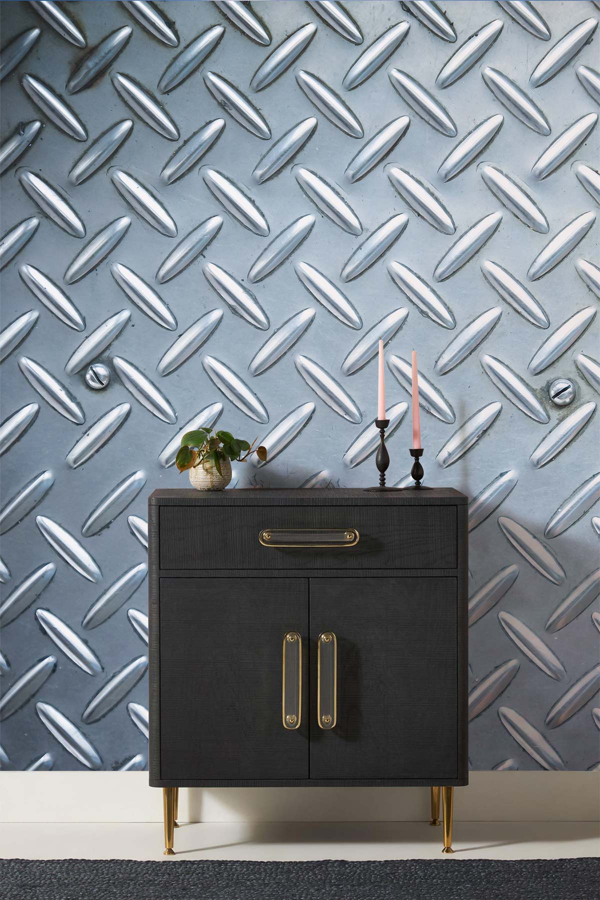 Industrial silver metallic diamond plate wallpaper with dark wood cabinet and industrial decor accents.