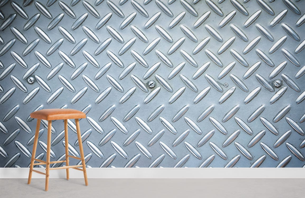 Industrial silver metallic diamond plate wallpaper, modern interiors, wooden stool, grey flooring.