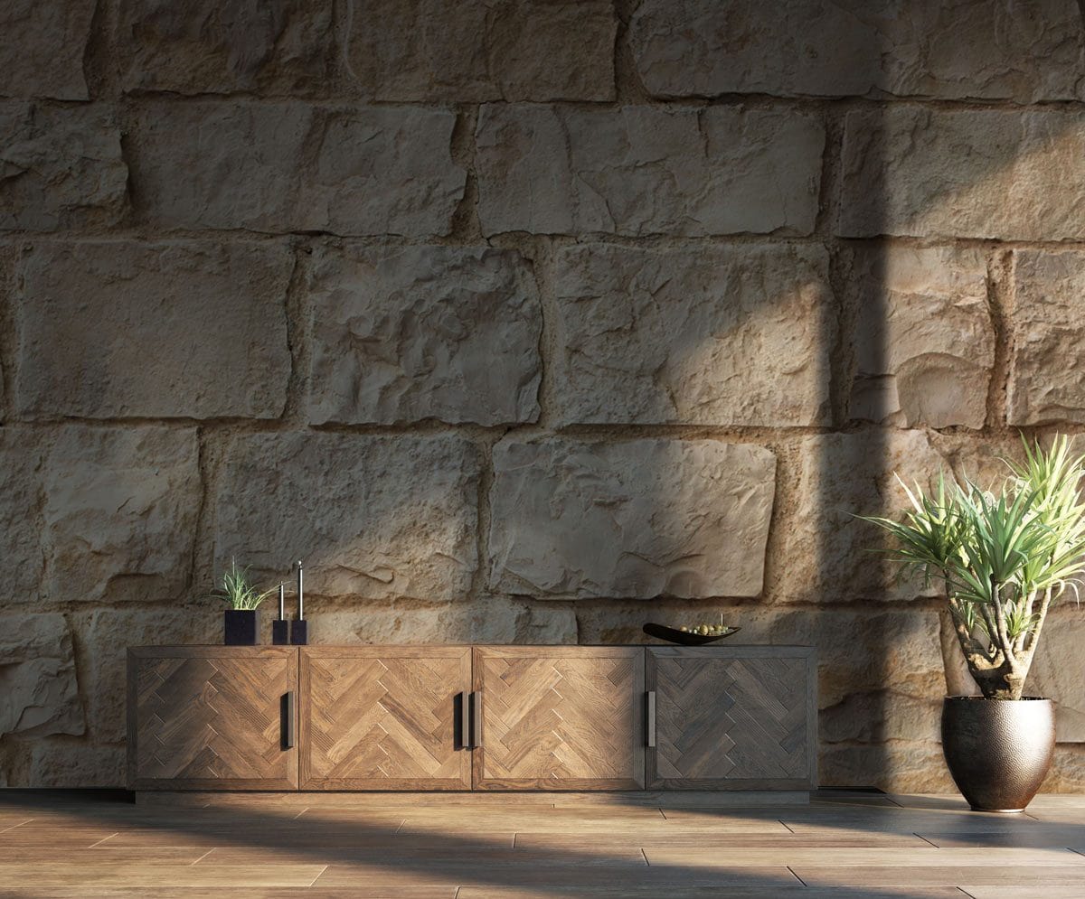 Rustic beige stone brick effect wallpaper, wooden cabinet, stone flooring, potted plant in living room.