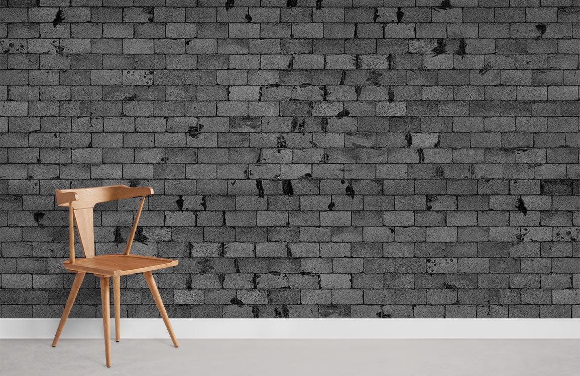 Urban Grey Brick Wall Effect Mural Wallpaper in modern room with light wooden chair and grey flooring.