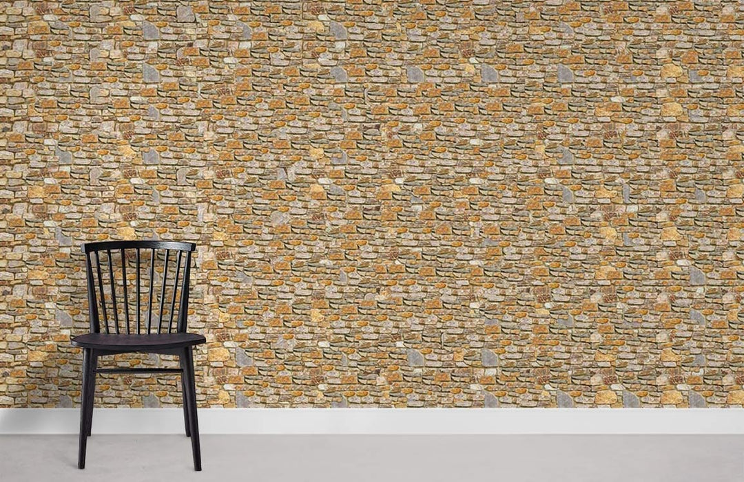 Black chair against rustic stone wall effect wallpaper, textured style, earth tones, grey flooring.