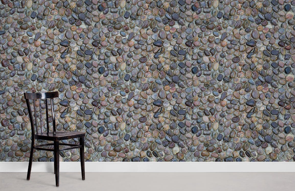 Natural Pebble Stone Textured Wallpaper, multicoloured rustic pattern with black chair, neutral flooring.