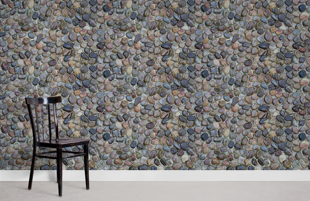 Natural Pebble Stone Textured Wallpaper, multicoloured rustic pattern with black chair, neutral flooring.
