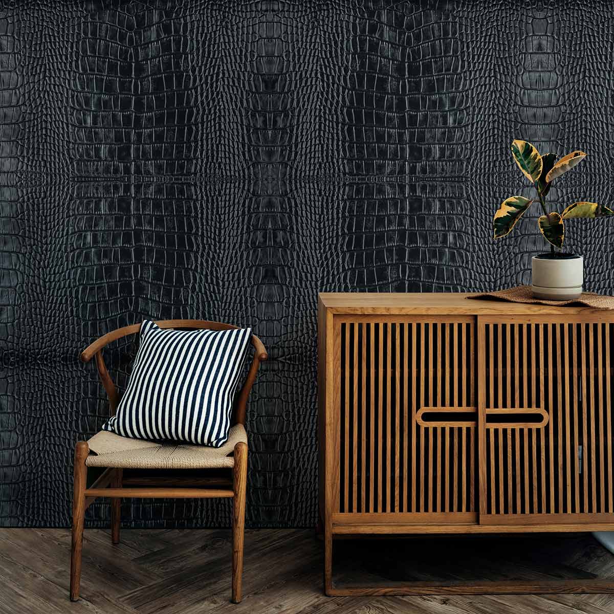 Luxurious dark grey crocodile wallpaper, wooden cabinet, striped cushion chair, elegant parquet flooring.