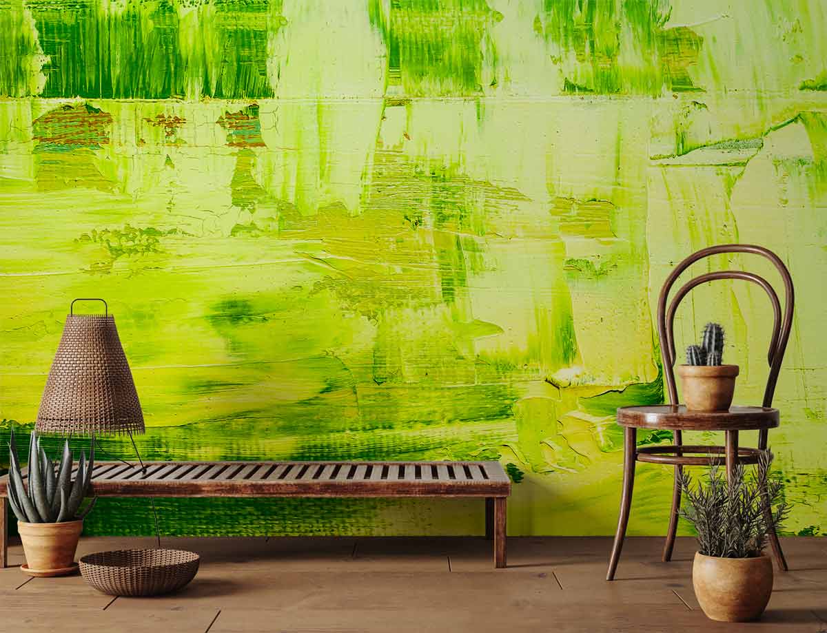 Lime abstract textured art wallpaper, wooden bench, rattan lamp, rustic chair, hardwood flooring.