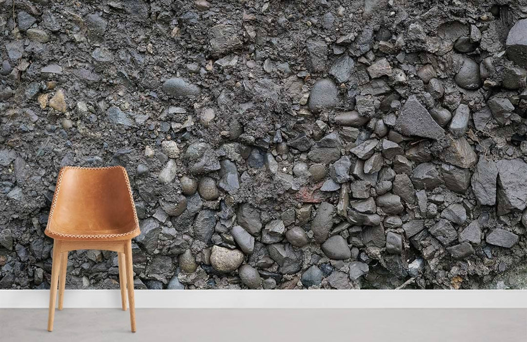 Urban industrial wallpaper with stone texture, grey tones; modern rustic decor, brown leather chair.