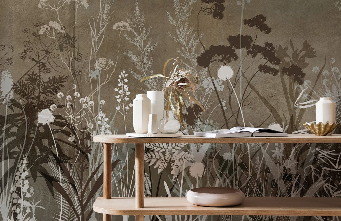 Vintage Botanical Meadow Mural Wallpaper features earthy tones, rustic elegance, with wooden table in foreground.