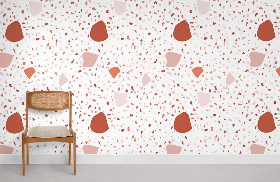Modern Terra Cotta and Cream Terrazzo Wallpaper with Mid-Century Chair on Grey Floor in Minimalist Room.