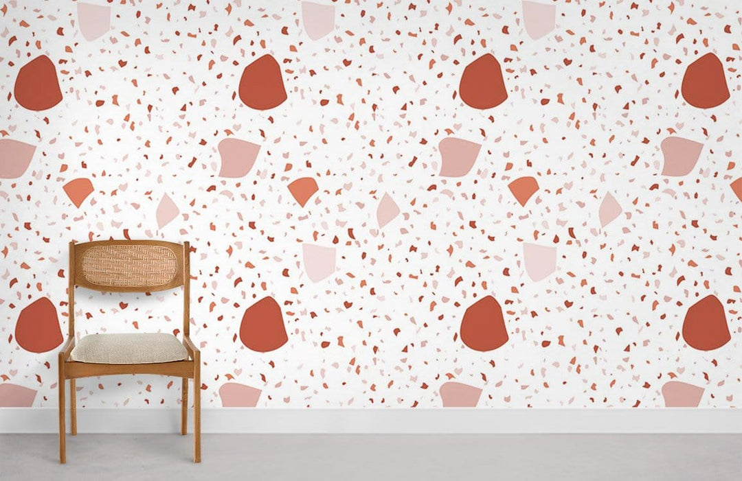 Modern Terra Cotta and Cream Terrazzo Wallpaper with Mid-Century Chair on Grey Floor in Minimalist Room.