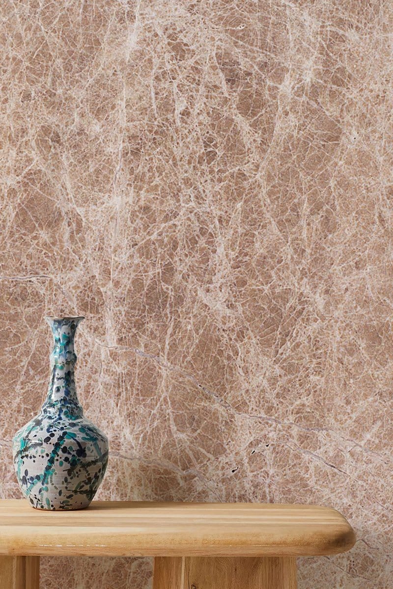 Elegant beige marble texture wallpaper with a rustic wooden table and decorative vase in luxurious interior.