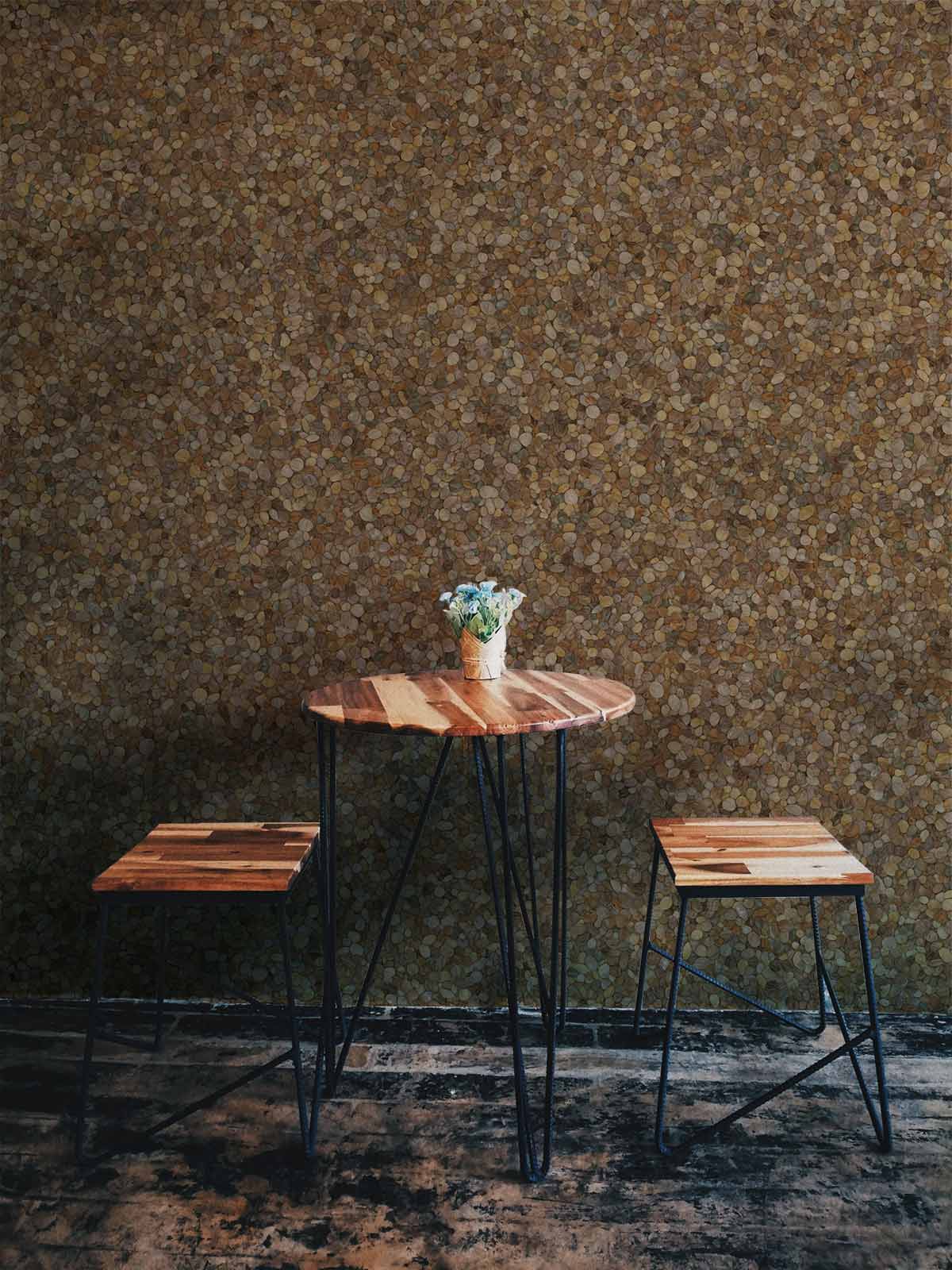 Textured Pebble Pattern Wallpaper in earthy brown, industrial dining set, rustic flooring, natural decor.