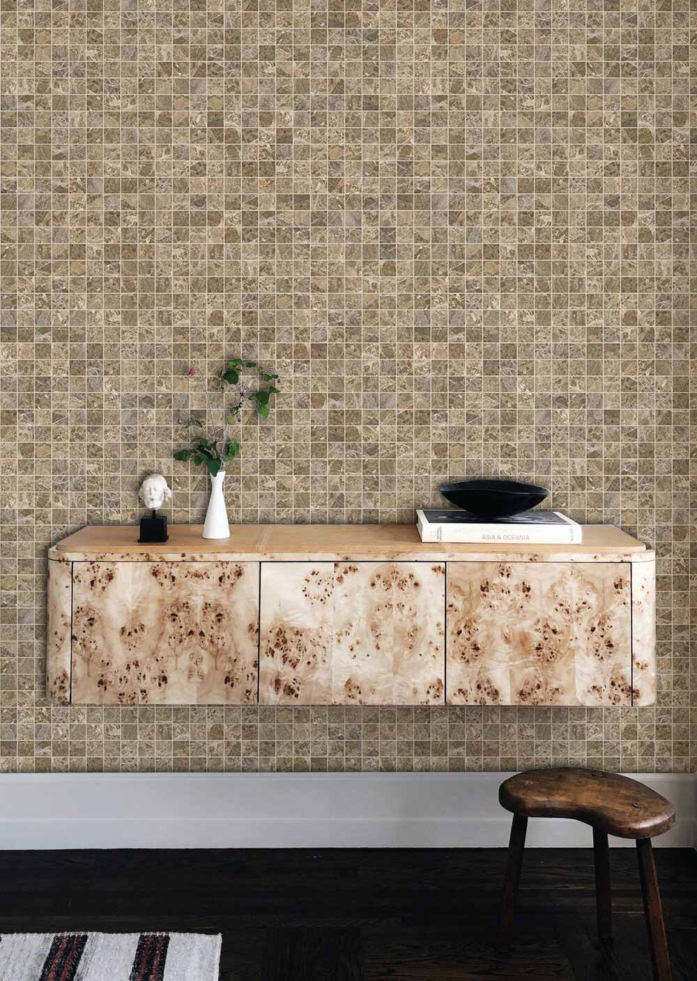 Elegant rustic mosaic beige textured wallpaper complements wooden sideboard and stool in chic living room.