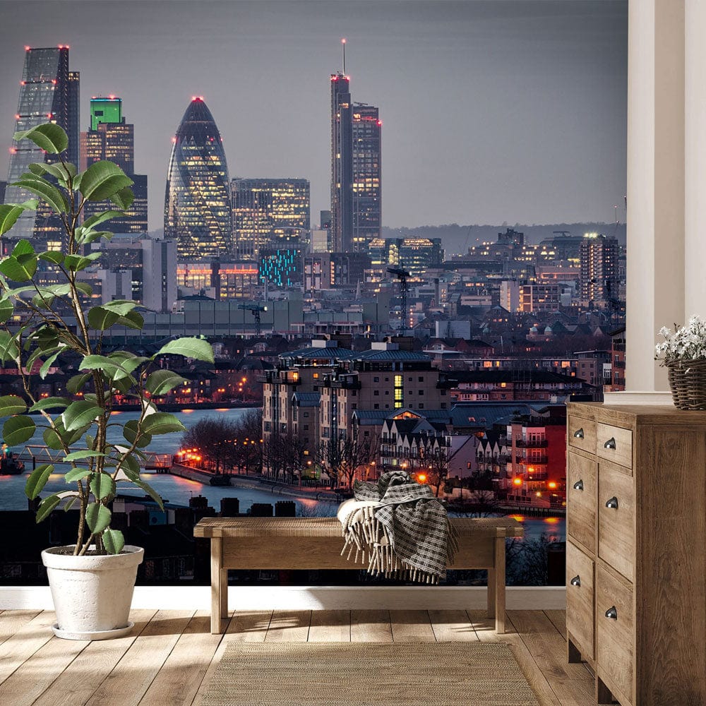 London skyline mural wallpaper in blue, wood dresser, bench, plant, light wood flooring, urban decor.