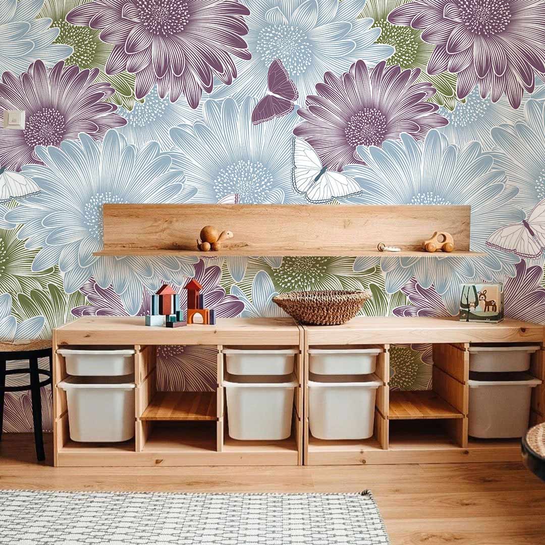 Floral butterfly wallpaper in children's room, wooden storage furniture, light wood flooring, playful decor.