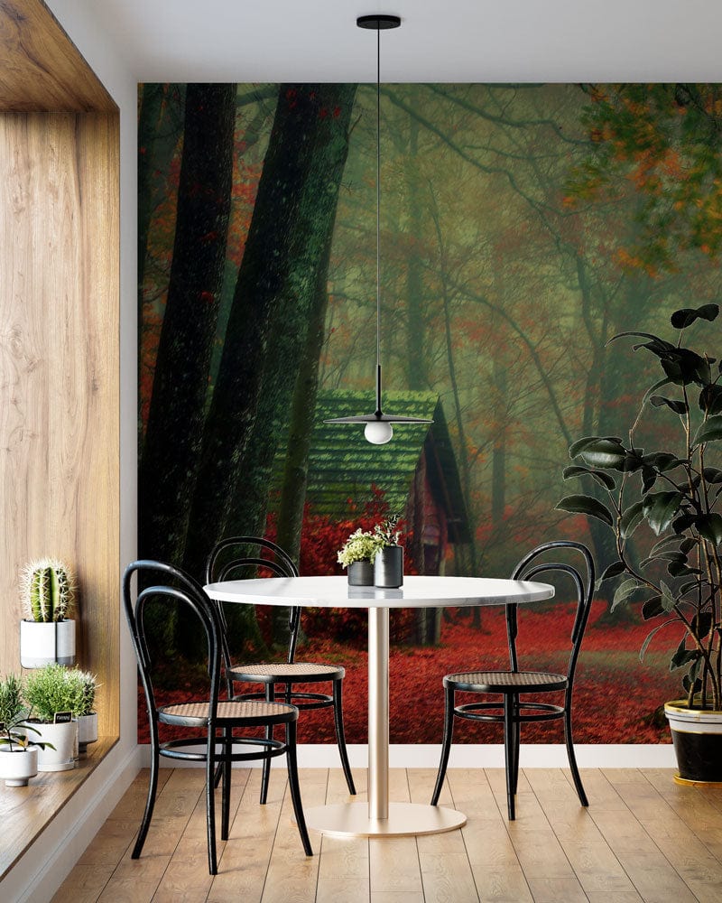 Enchanted Autumn Woodland wallpaper in dining room with wooden flooring and elegant black chairs.