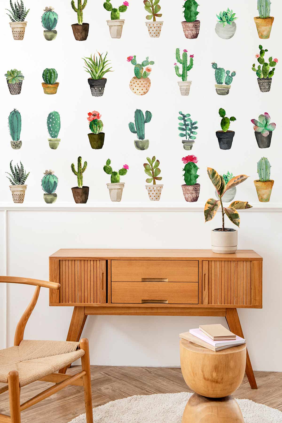 Charming cactus wallpaper with watercolour design, wood sideboard, modern chair, and wooden flooring.
