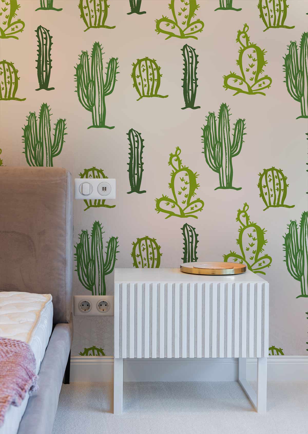 Green Cacti wallpaper in bedroom with beige sofa, white bedside table, complements modern interior design.