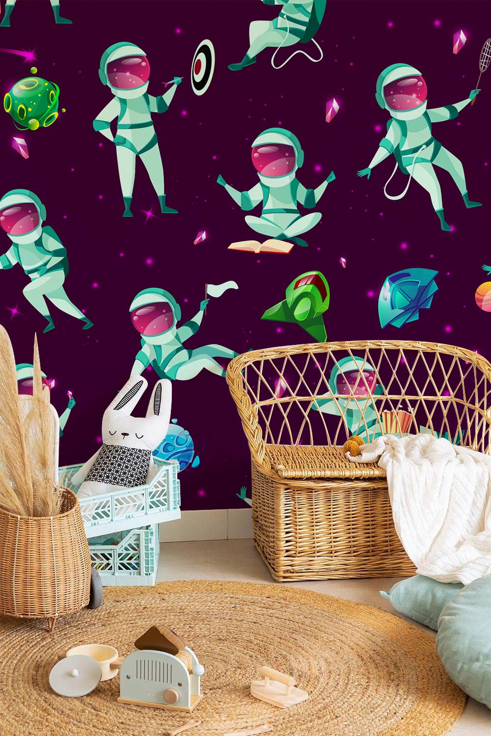 Playful Astronaut Galaxy Kids' Mural Wallpaper; wicker chair; woven rug; cosy kid's room decor.