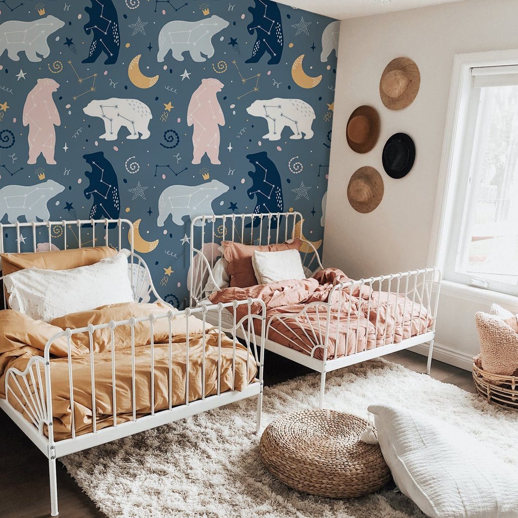 Enchanted Night Sky Bear Pattern Kids Mural Wallpaper, blue tones, white beds, woven decor, cosy rug.