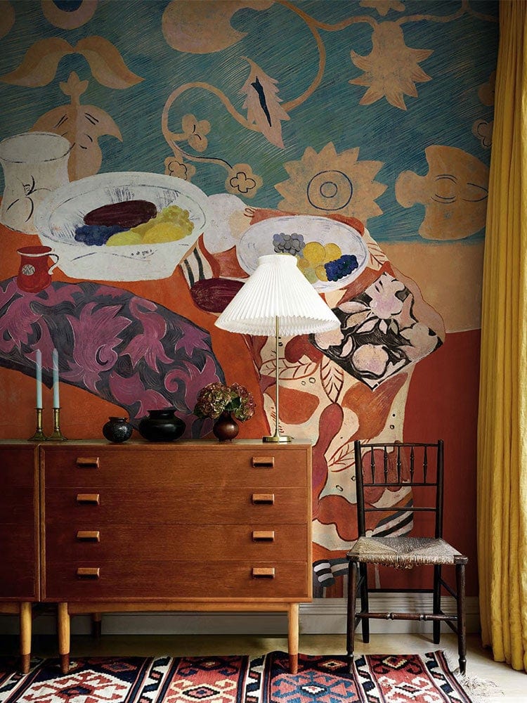 Eclectic Bohemian Feast Mural Wallpaper, earthy tones, artistic patterns, wooden sideboard, black chair.
