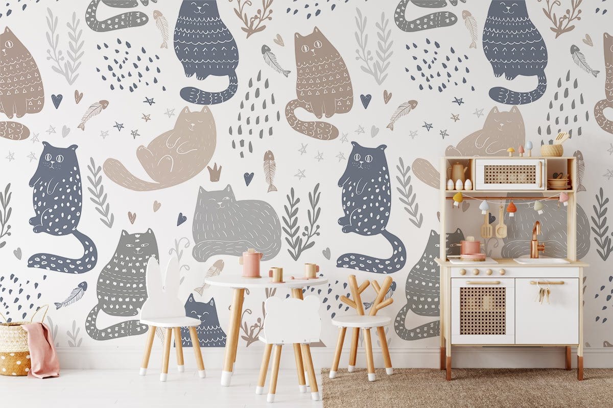 Whimsical pastel cat pattern wallpaper in playful kids' room; features white chairs, play kitchen set.