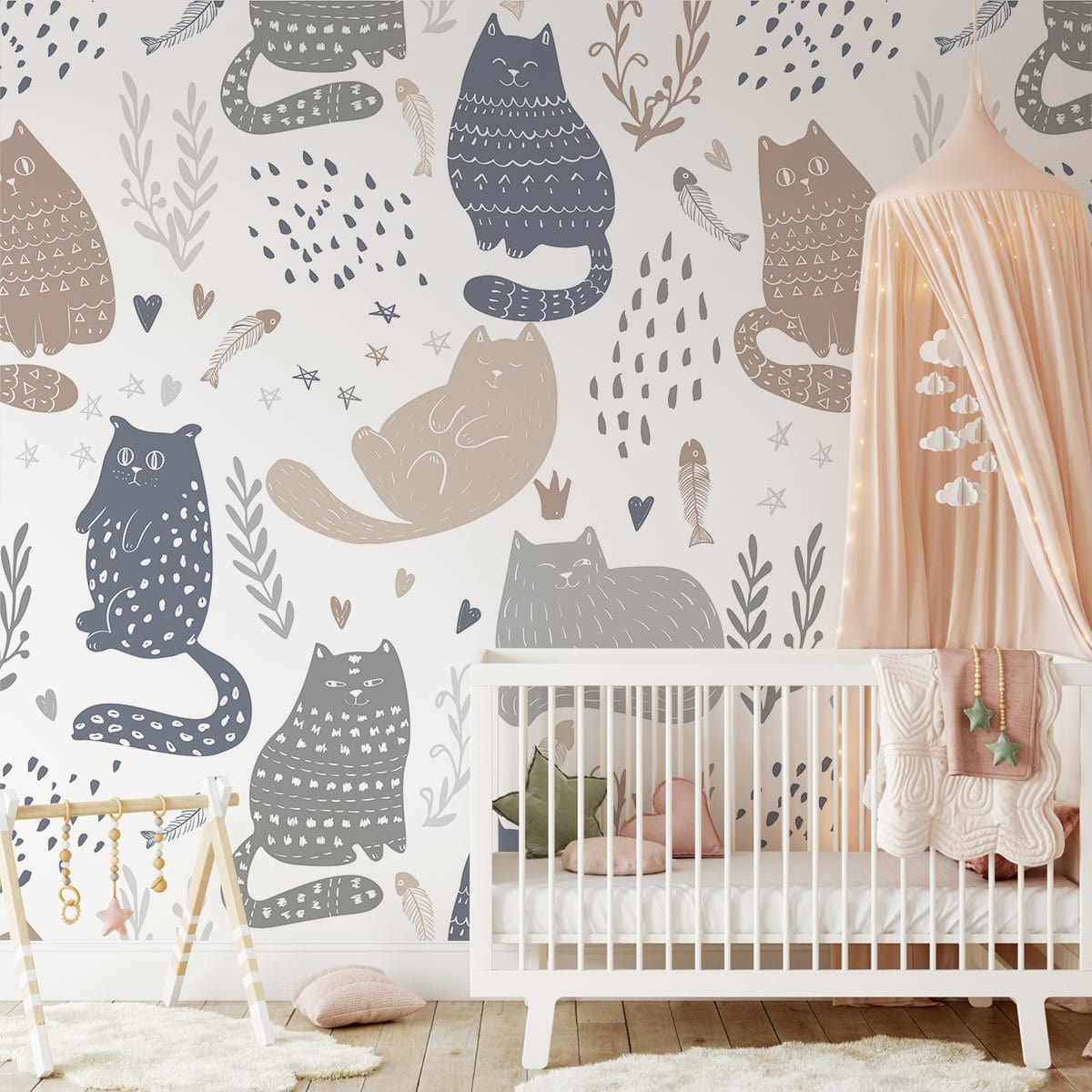 Whimsical pastel cat pattern wallpaper in nursery with white crib and peach canopy, wooden flooring.
