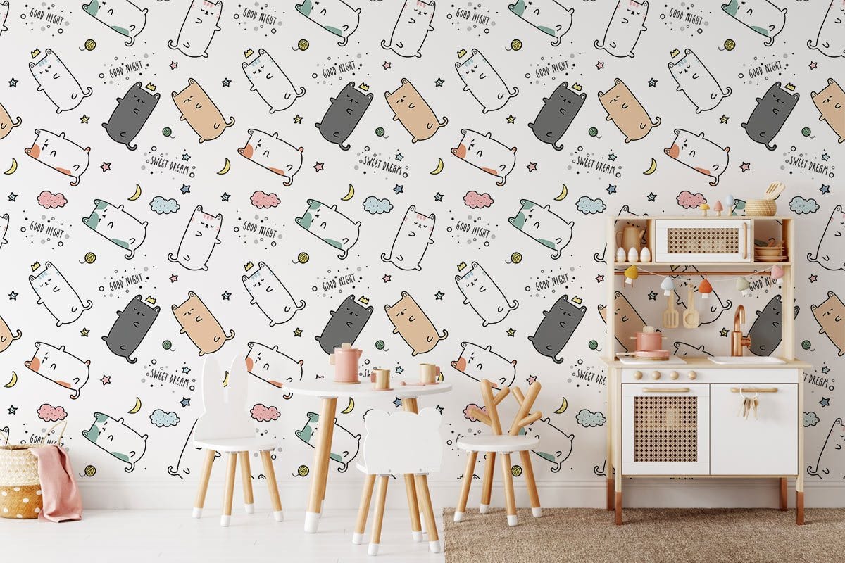 Playful pastel cat pattern wallpaper in kids' bedroom with wooden furniture and soft-coloured decor.