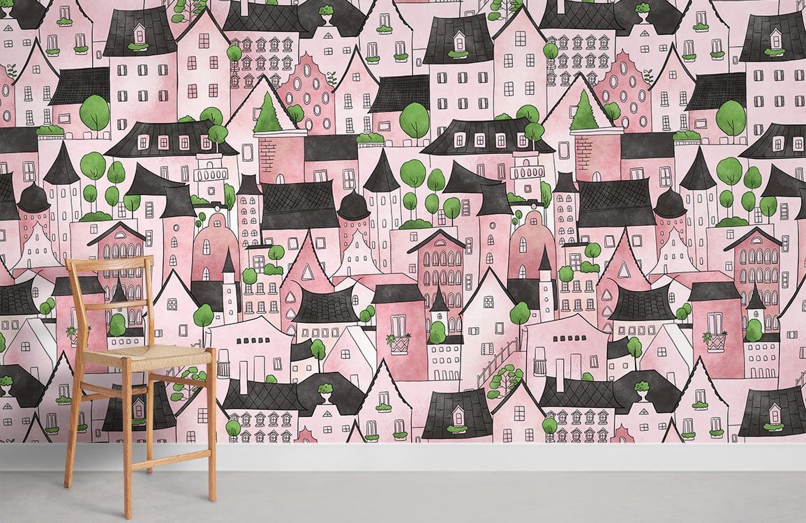 Charming pink village fantasy mural wallpaper with green accents in a room with wooden chair.