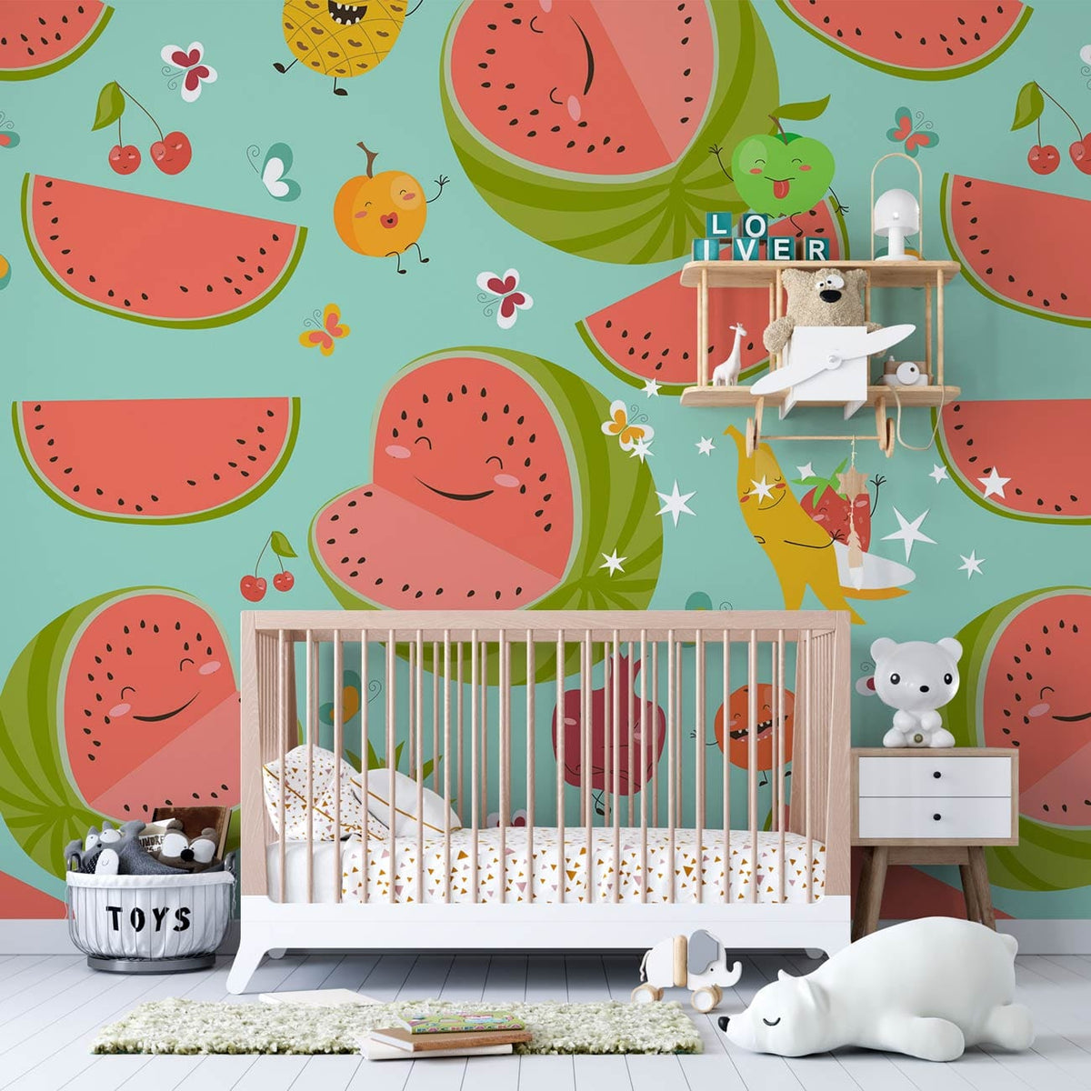 Playful pastels fruit wallpaper with watermelon and banana motifs in nursery room with wooden cot.