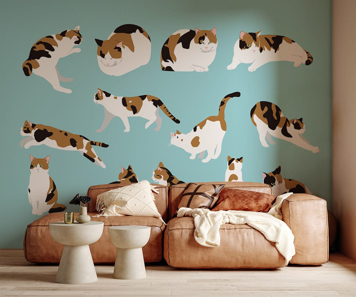 Charming Calico Cats Wallpaper on Blue Wall; beige sofa, modern stools; living room decor.