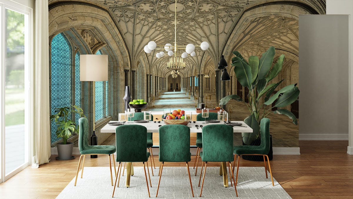 Dining room with Gothic Revival mural wallpaper, green velvet chairs, modern chandelier, and wooden flooring.