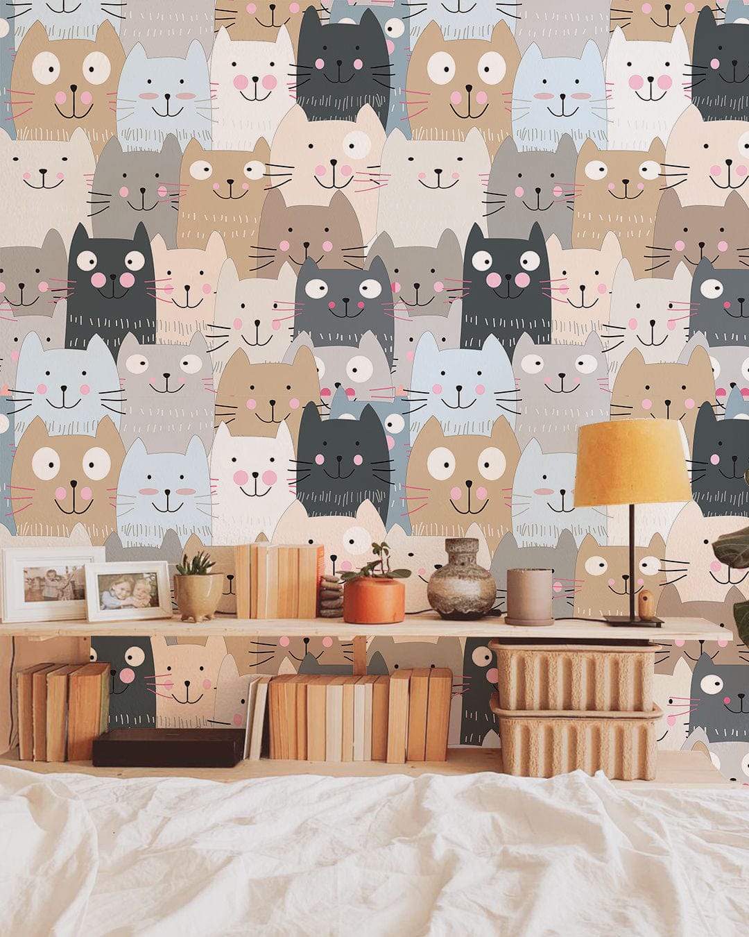 Playful pastel cats wallpaper, perfect for nursery decor; includes bed, lamp, and shelves.
