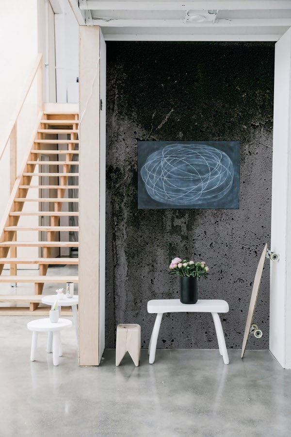 Urban Industrial Concrete Texture Mural Wallpaper in rustic grey with blackboard art and minimal modern furniture.