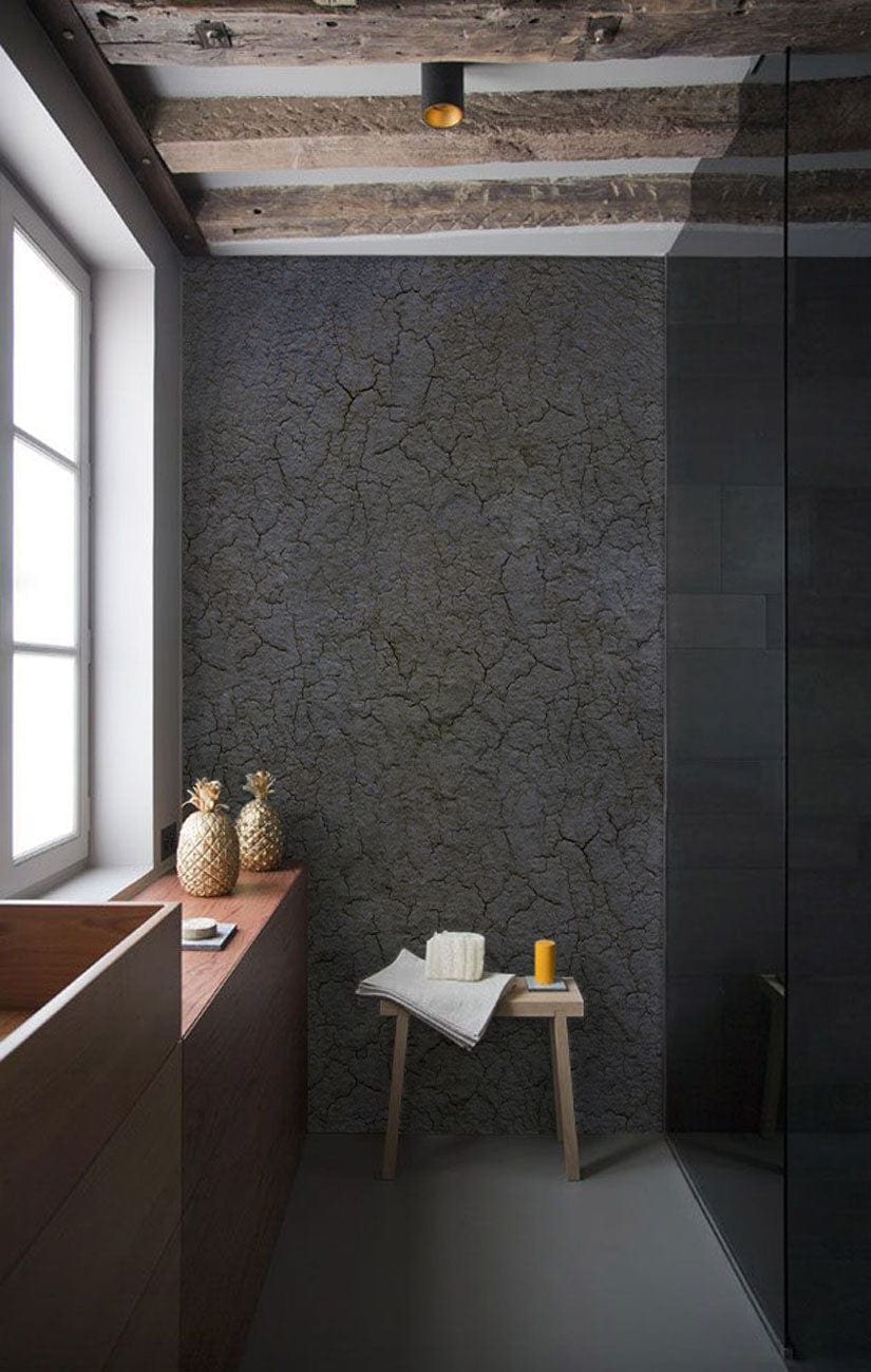 Textured cracked grey wallpaper, rustic bathroom, wooden beamed ceiling, wooden sink, glass shower screen.