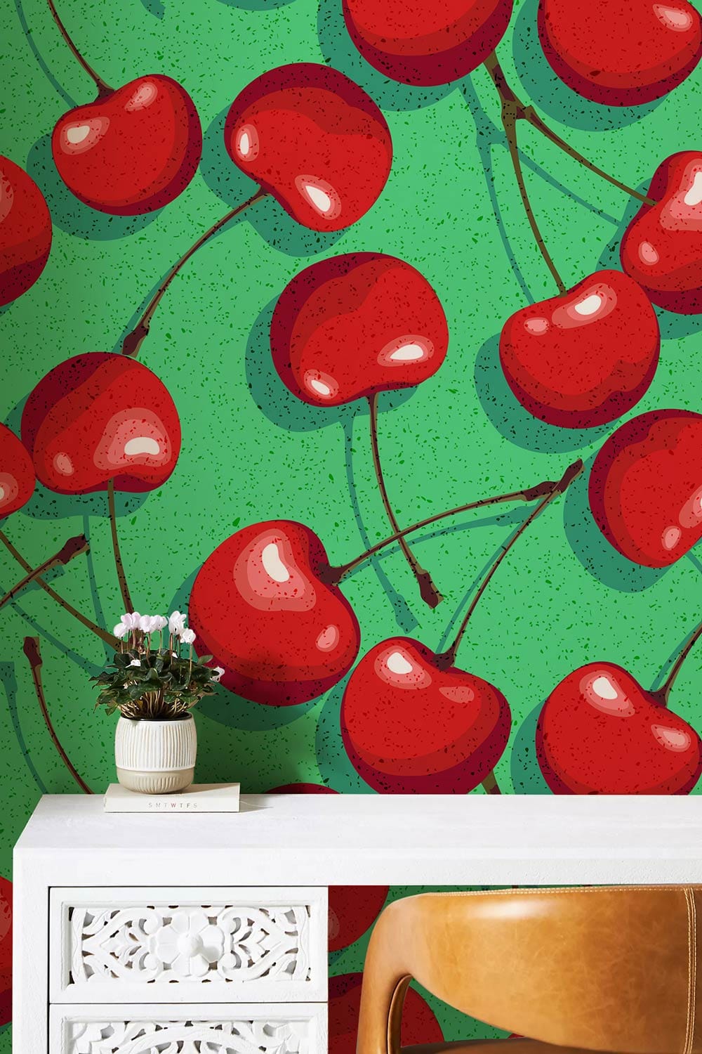 Retro red cherry wallpaper, vibrant green background, white decorative table, brown chair, floral decor.