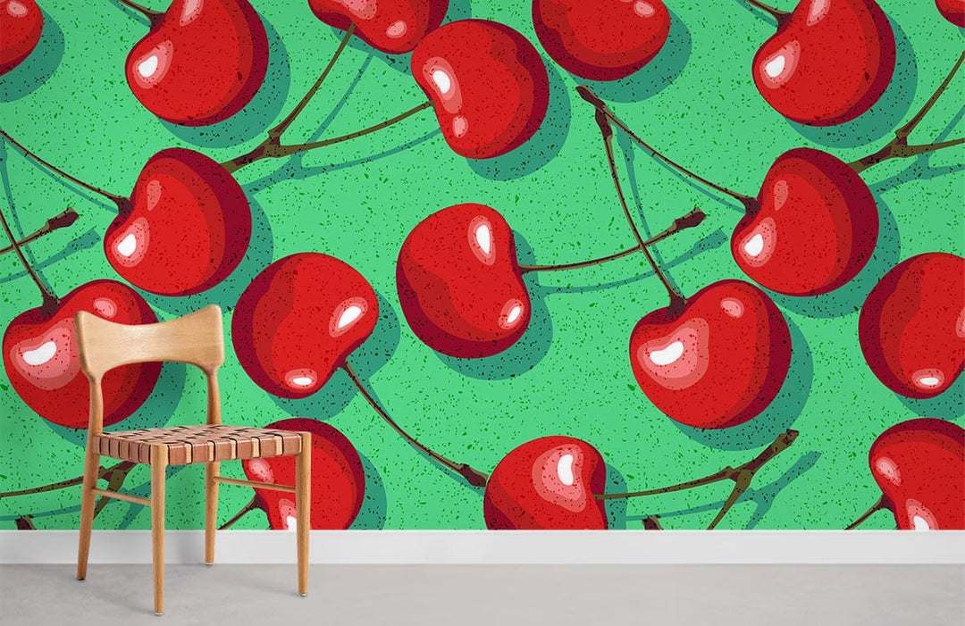Retro red cherry patterned wallpaper with vibrant green background, simple wooden chair on grey flooring.