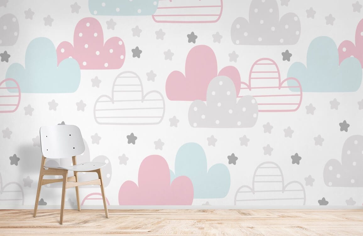 Pastel Cloud Dreams nursery wallpaper with pink, blue clouds; features white chair, wooden flooring.