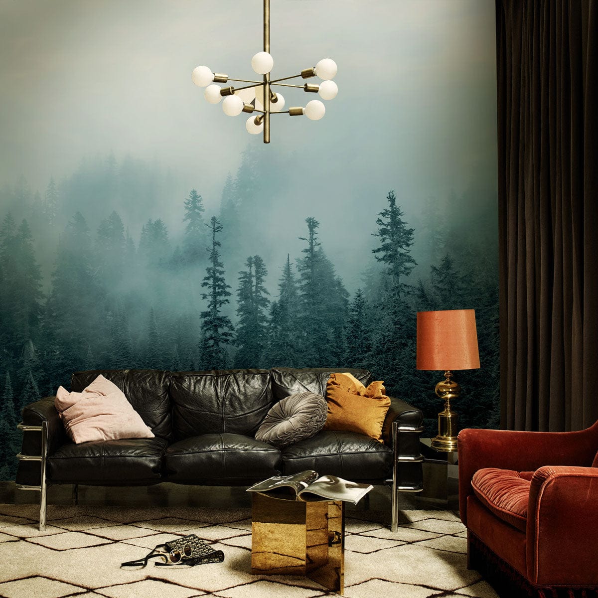 Misty Forest Green Landscape Mural in cosy living room with black leather sofa, modern lighting.
