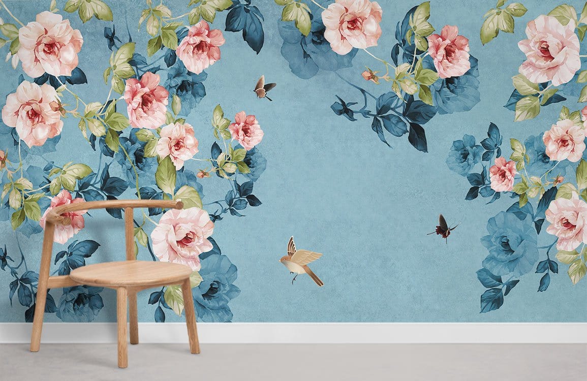 Vintage mural wallpaper with blue, pink roses, wooden chair, and concrete flooring in living room.