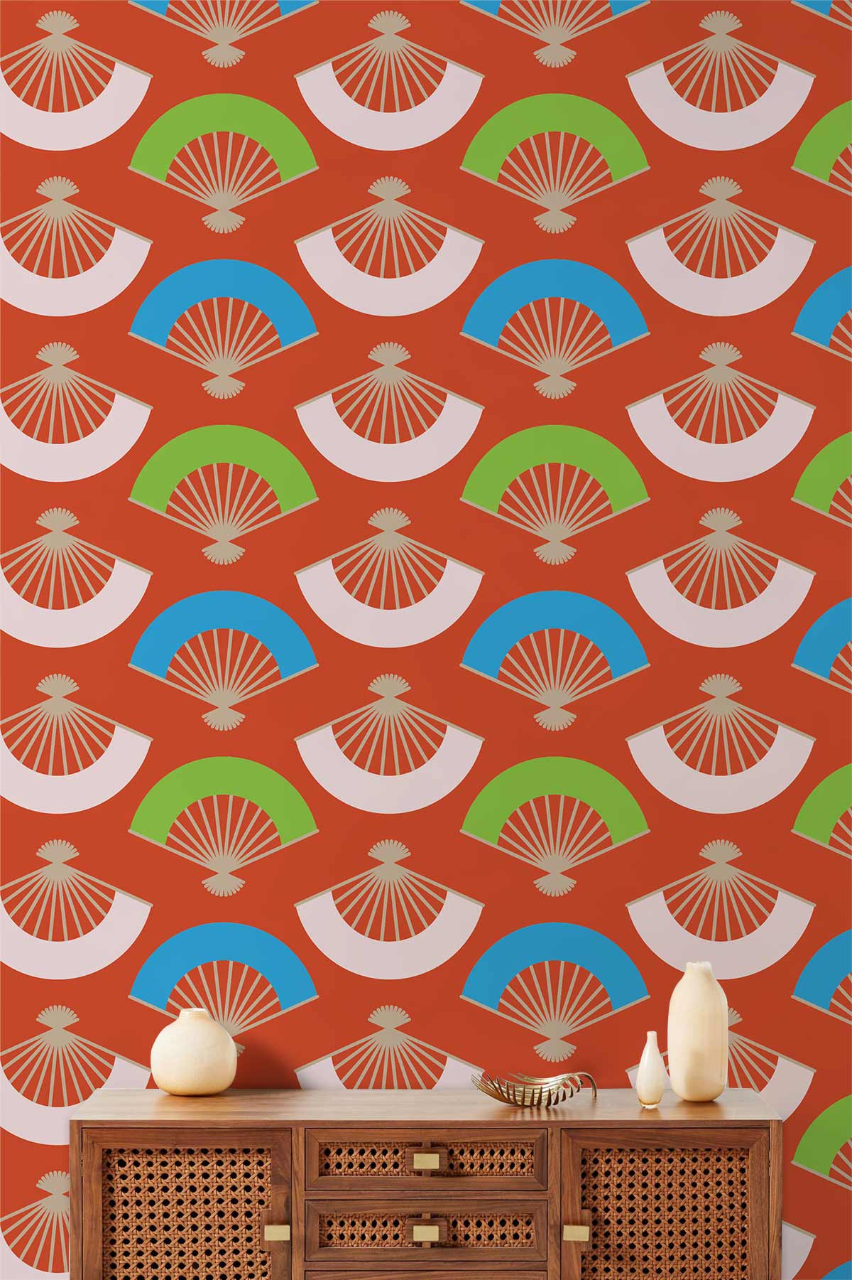 Vibrant retro fan pattern wallpaper, red-green-blue design, with wooden cabinet; bold room interior.
