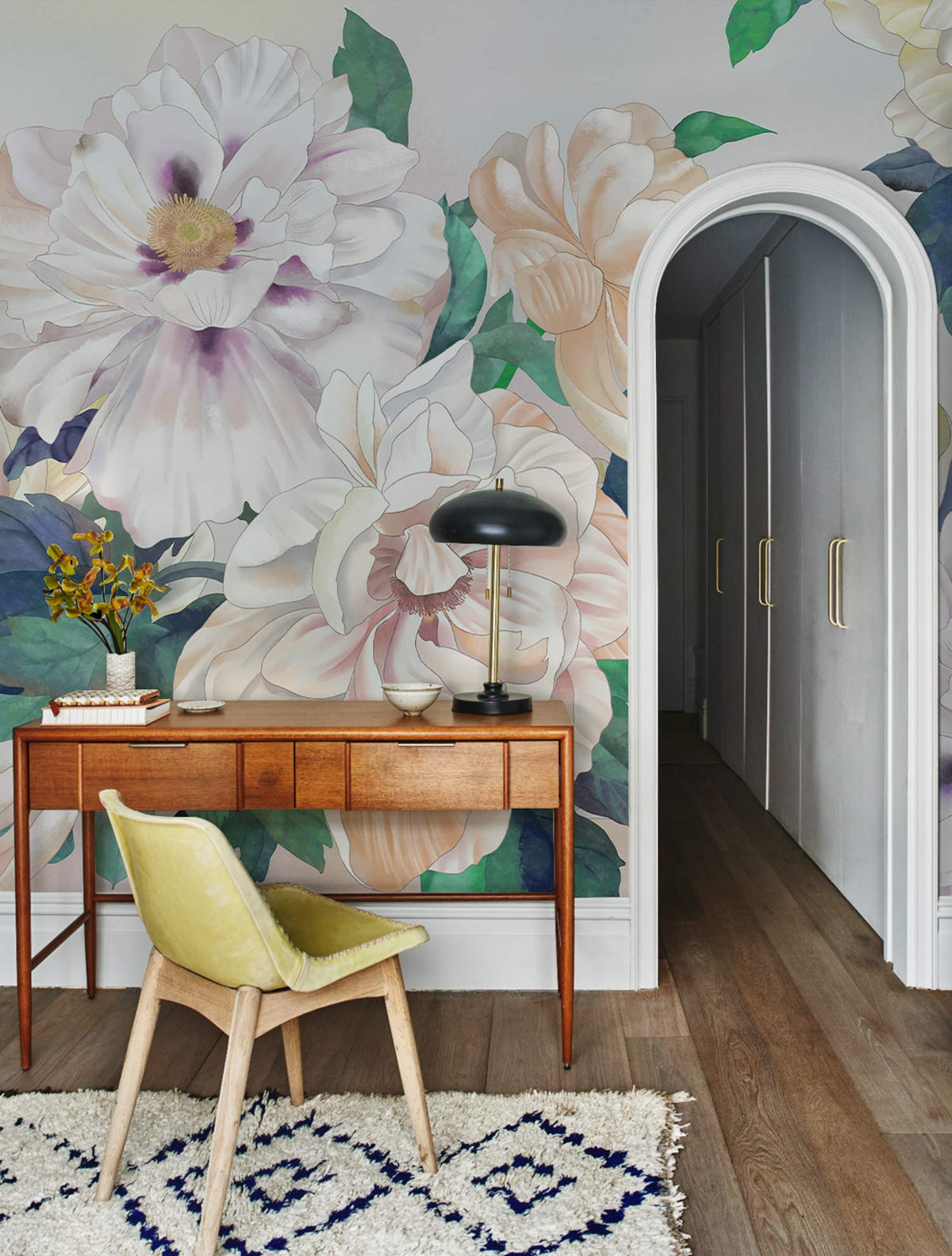 Elegant Pastel Blooms Mural Wallpaper, wooden desk, green chair, archway, light wood flooring.