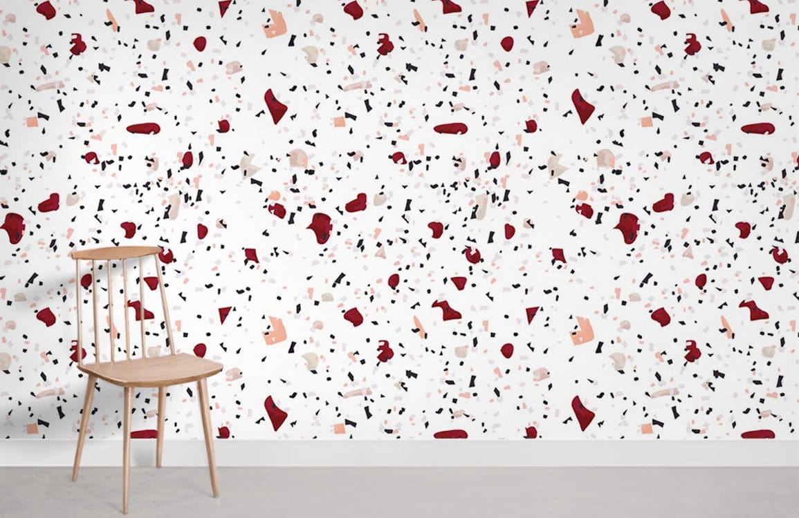 Retro Chic terrazzo wallpaper in red, black, and cream. Wooden chair, light-toned flooring.