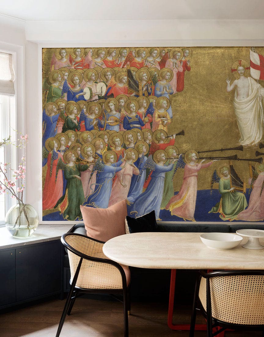 Medieval Gothic Angelic wallpaper in gold hues, dining room setting with modern furniture on wooden flooring.