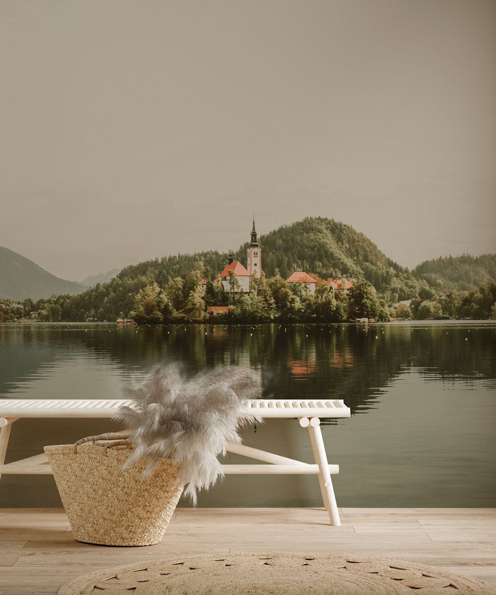 Tranquil Lakeside Village Mural Wallpaper, with white bench and wooden flooring in living room.