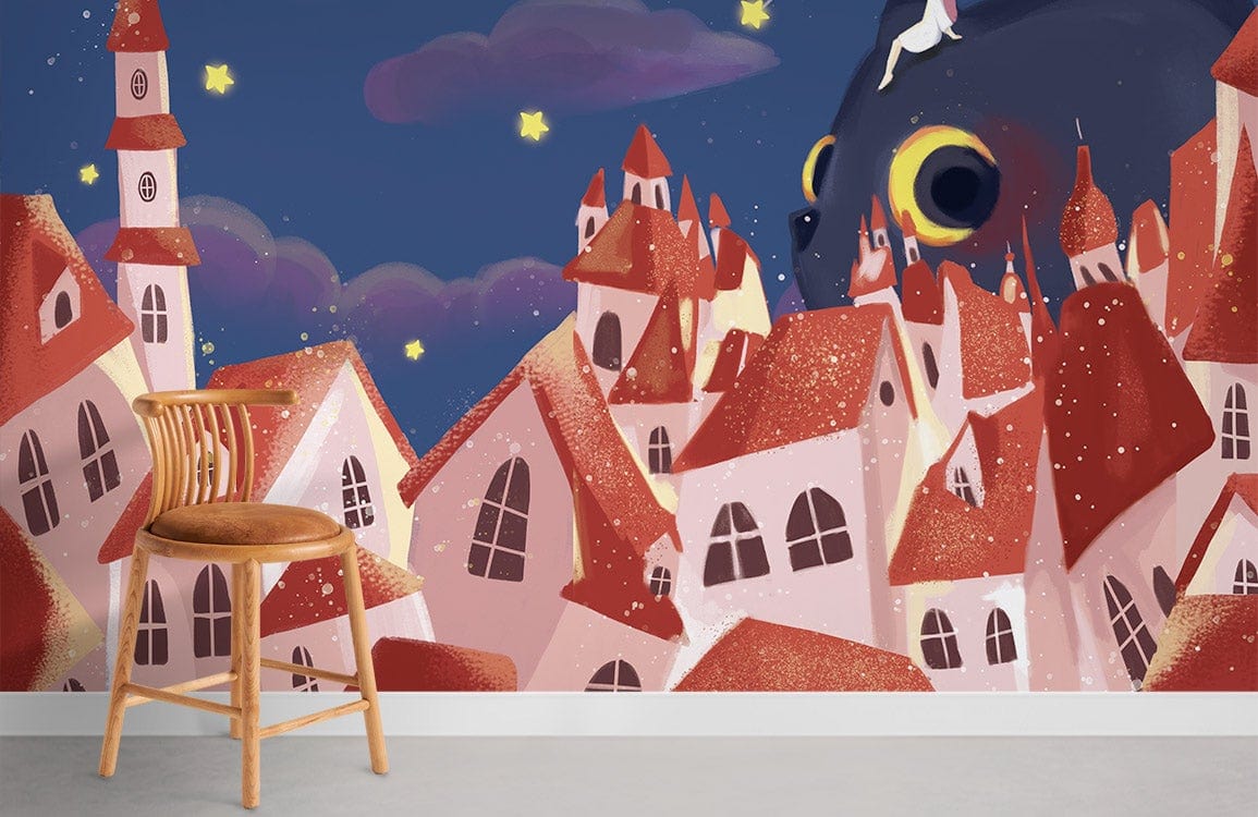 Whimsical cat and village mural wallpaper with a wooden chair, grey flooring in a colourful room.