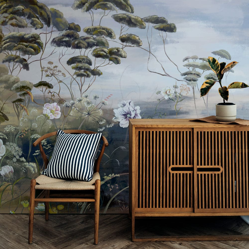 Tranquil woodland floral mural, Earth tones, pastel hues, wooden cabinet, herringbone floor, cosy chair.